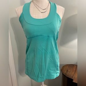 Lululemon green tank top with built in bra size 10. Excellent condition.